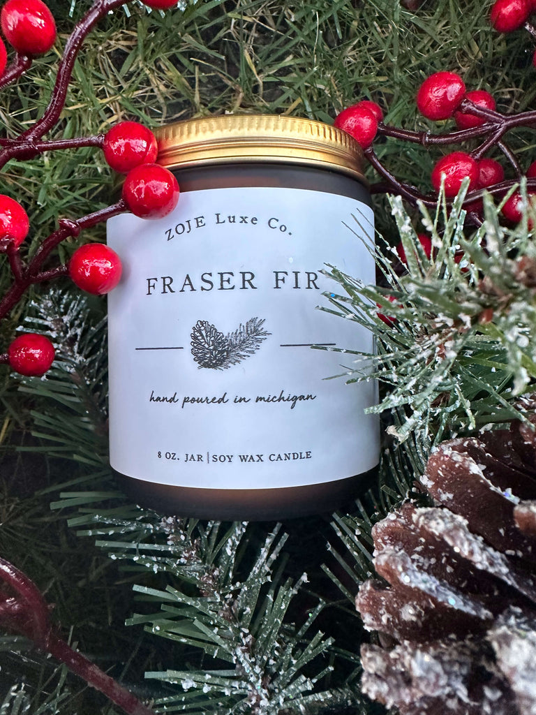 Our Fraser Fir candles begins with top notes of cypress and zesty lemon peel that fold into woodsy mid notes of evergreen and cedar. The rich base of fir, amber, and moss evokes fond memories of decorating a freshly-cut Christmas tree. Fraser Fir is perfect for setting a festive holiday mood or creating a cozy ambience for a quiet winter evening by the fire.